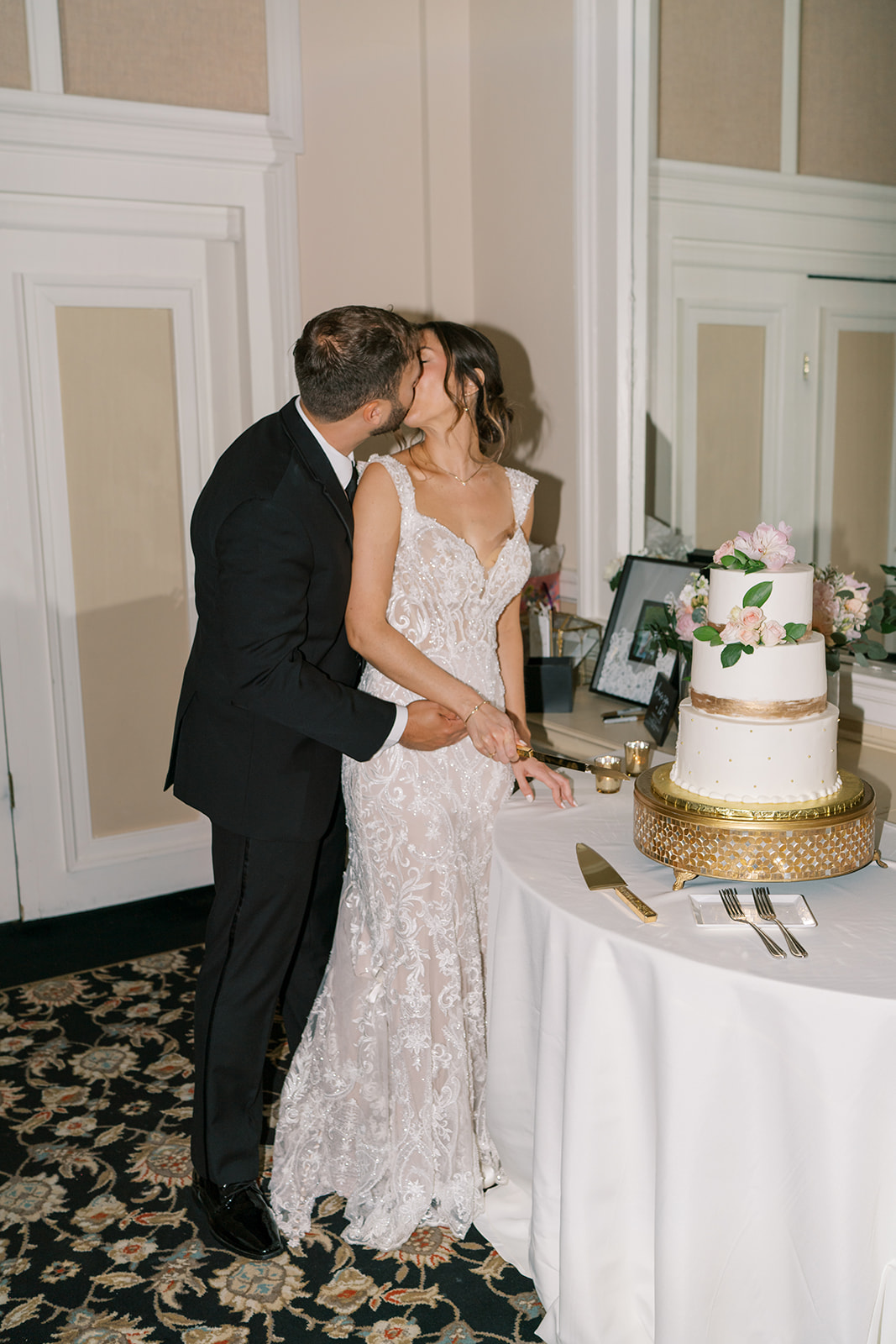 bride and groom cutting wedding cake